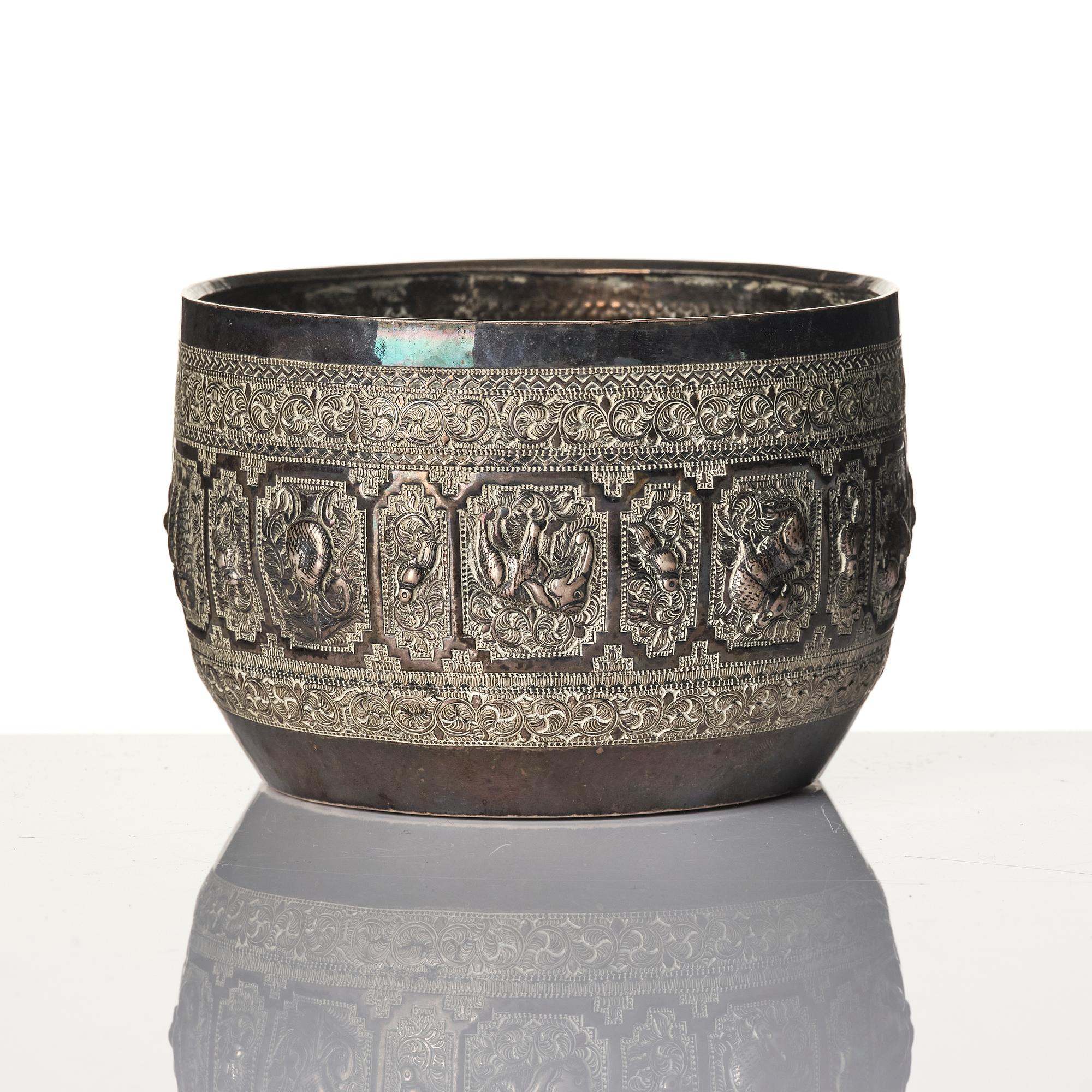 A Chinese brushpot, Qing dynasty, circa 1900. An archaistic bronze ewer and a silvered South East Asian bowl with stand.