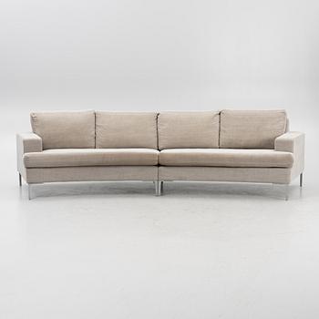 A 'Curve' sofa with a foot stool, Ire, 21st Century.