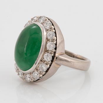 A jade and round brilliant-cut diamonds with a total weight of circa 0.60 ct.