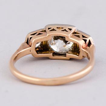 A RING, old cut diamond, brilliant cut diamonds, 14K gold. Westerback, Helsinki Finland 1958.