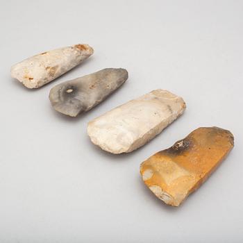 Four neolithic flint axes.