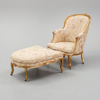 A Louis XV-style bergère armchair with stool, second half of the 19th century.