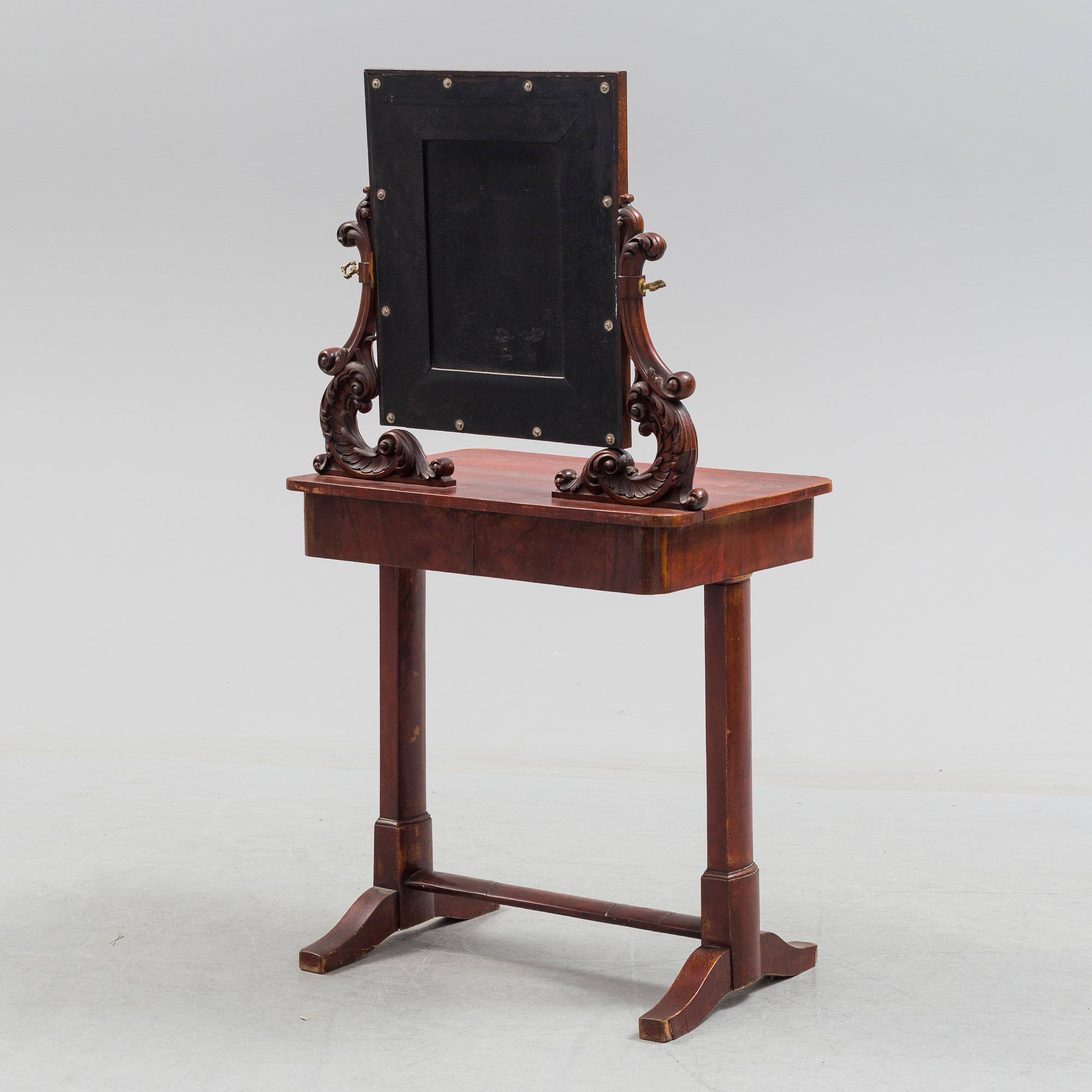 A mid 19th century late empire dressing table.