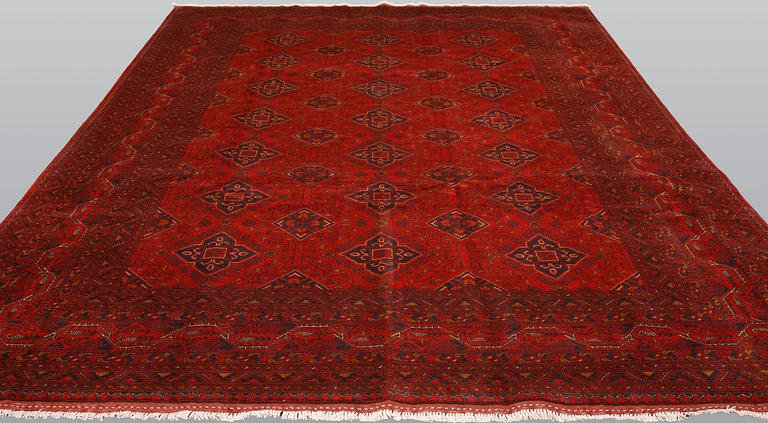 An Afghan carpet, 343 x 243 cm.