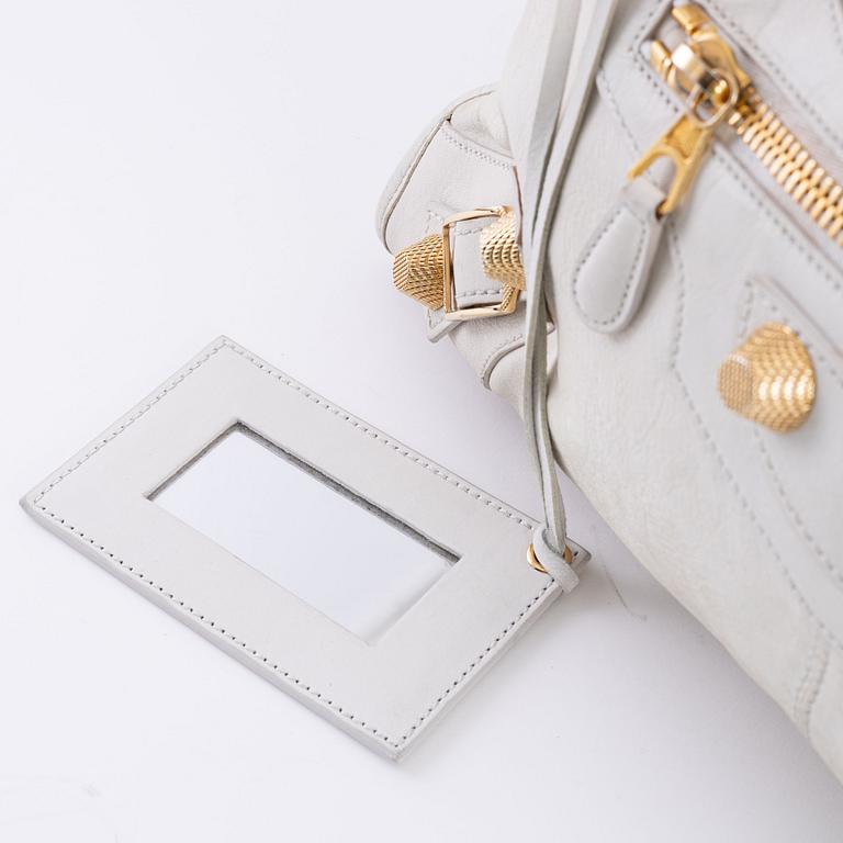 Balenciaga, a white leather 'City' bag.