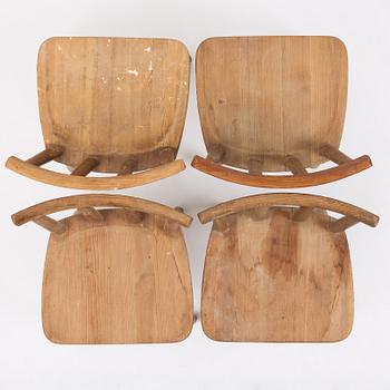 Axel Einar Hjorth, a set of four stained pine "Utö" chairs, Nordiska Kompaniet, Sweden, 1930s.