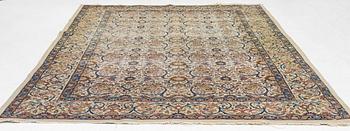 A Tabriz carpet, semi-antique, c. 330 x 230 cm.