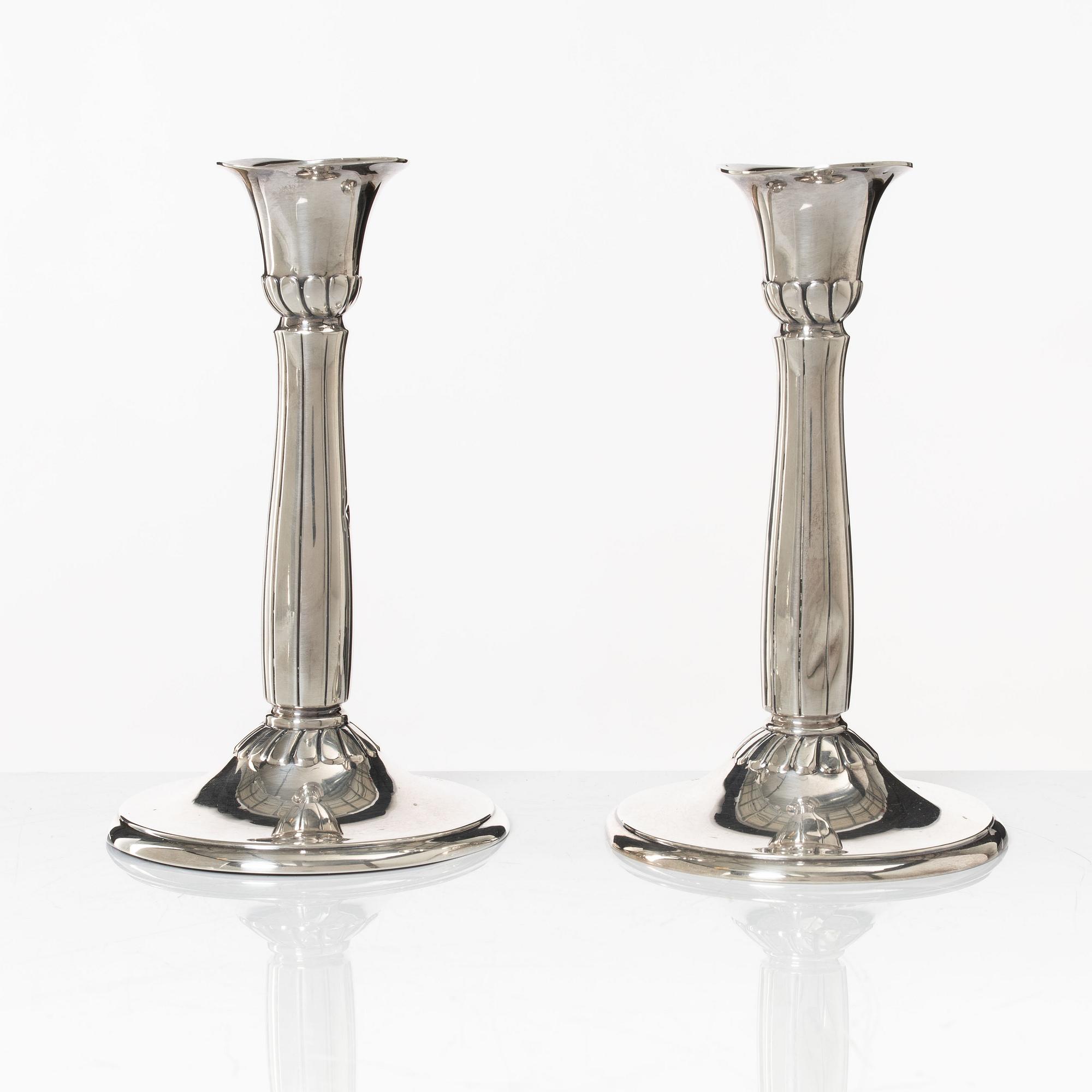 A pair of silver candle sticks, first half of the 20th century.