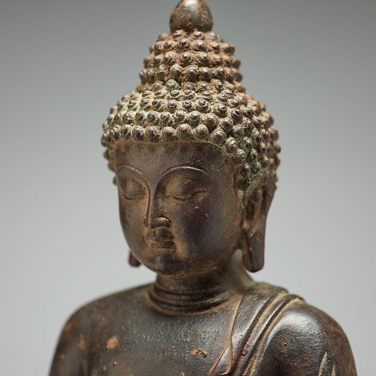 A bronze seated figure of Shakayamuni buddha, Mingtype.