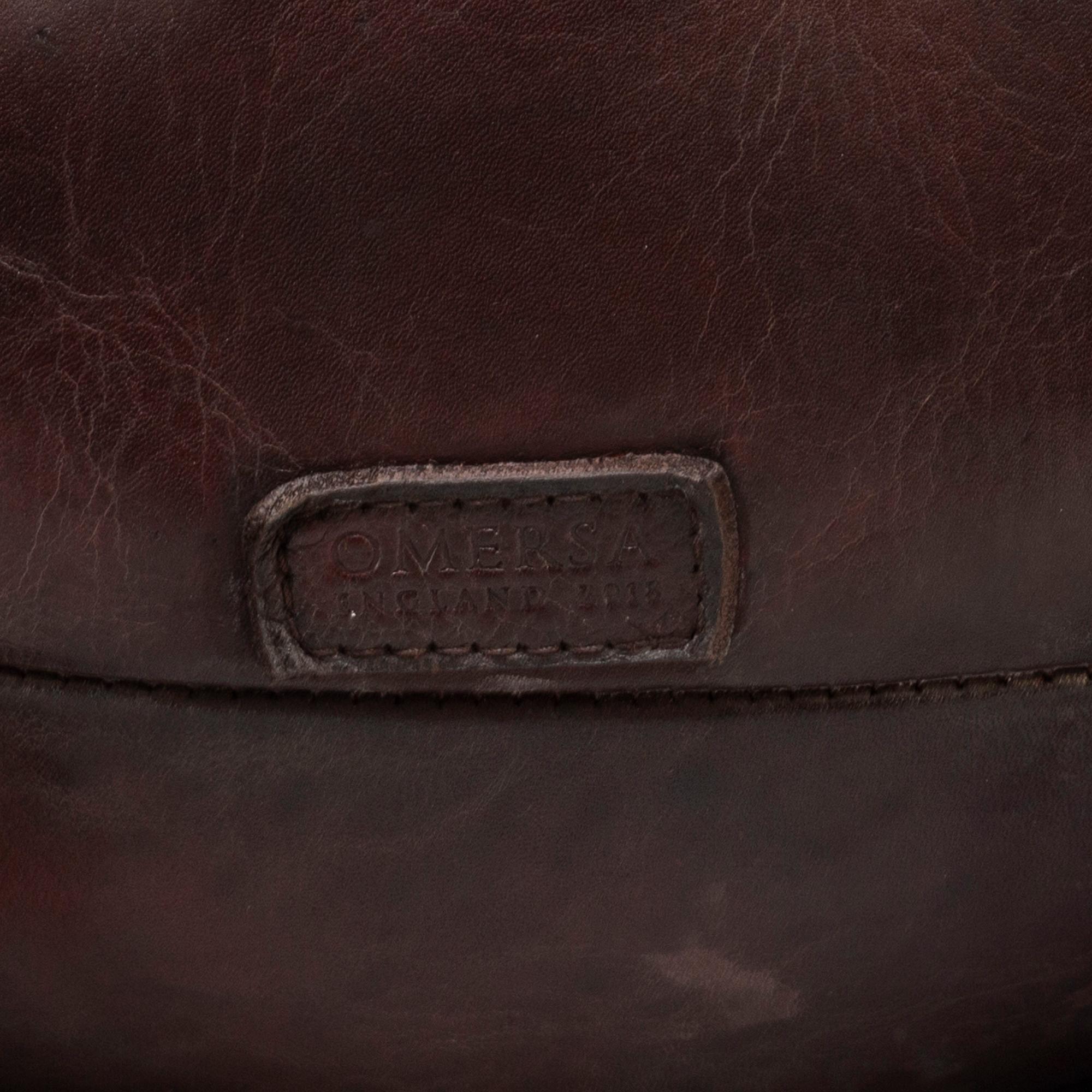 A leather footstool by Dimitri Omersa & Co.