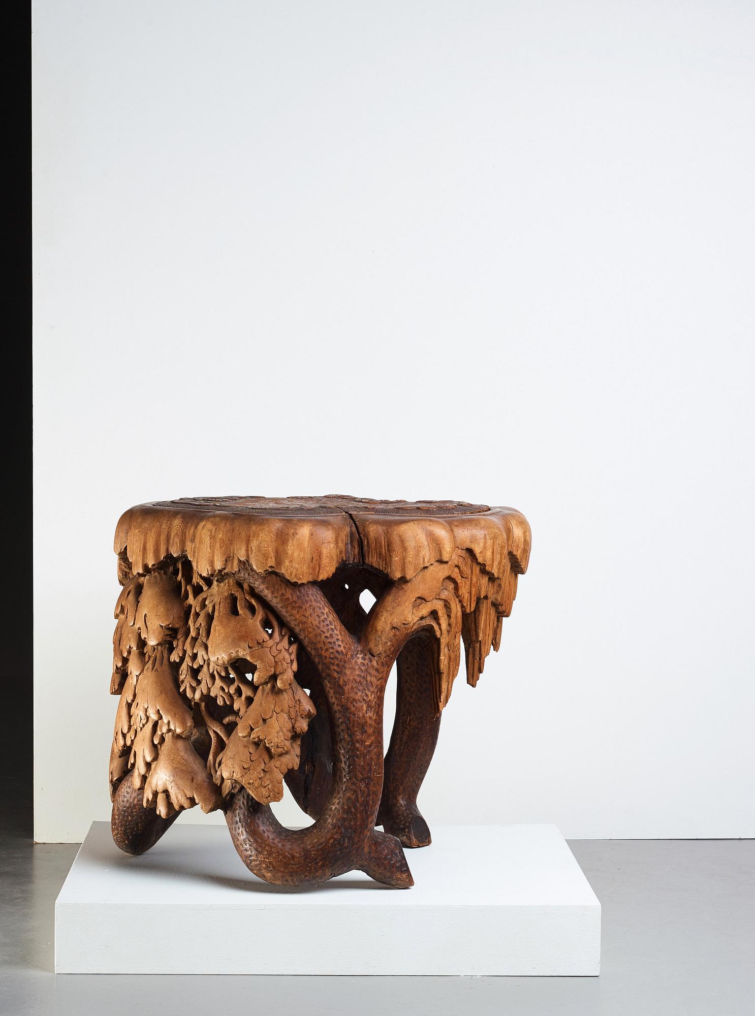 Knut Fjaestad, A Knut Fjaestad Art Nouveau sculptured pine table, Sweden ca 1900.