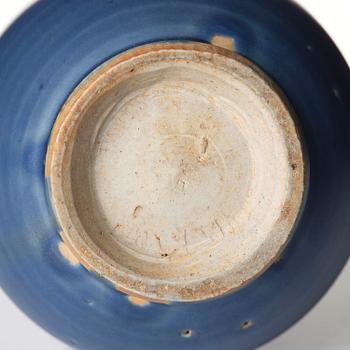 A blue glazed vase with a dragon in relief, late Ming dynasty/early Qing dynasty.