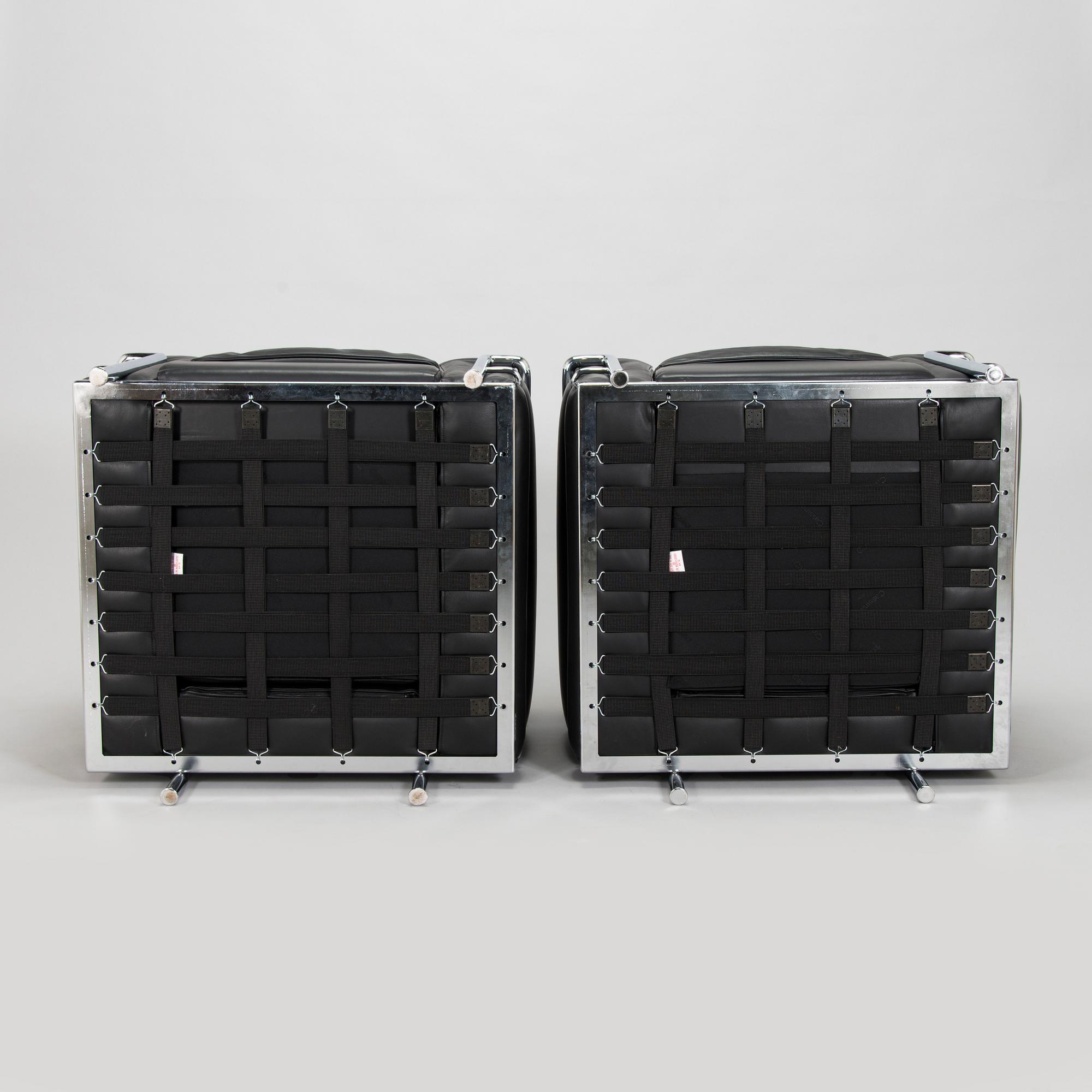 Pierre Jeanneret, Charlotte Perriand & Le Corbusier, a pair of 'LC2' armchairs, Cassina, Italy.