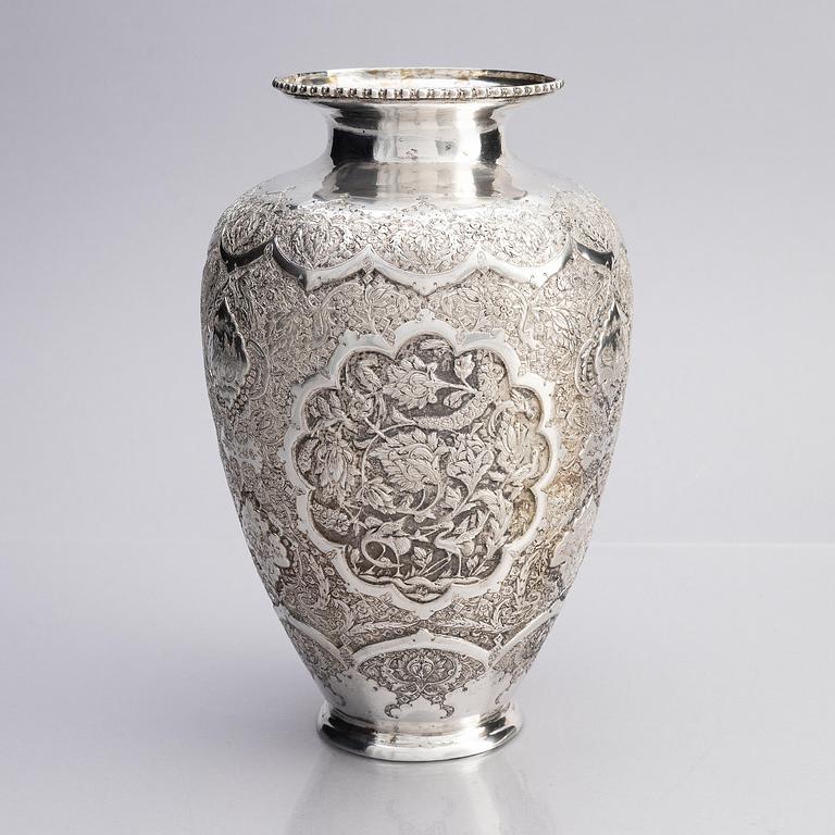 A Persian silver vase, late Qajar dynasty around 1910.