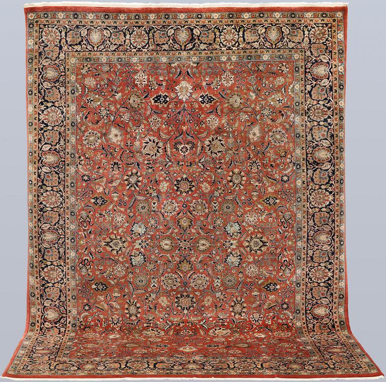 An oriental rug, c. 295 x 205 cm.