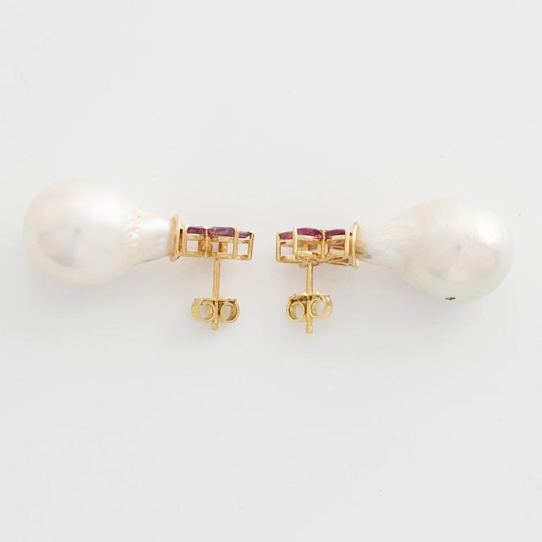 Earrings with cultured baroque freshwater pearls and pink sapphires.