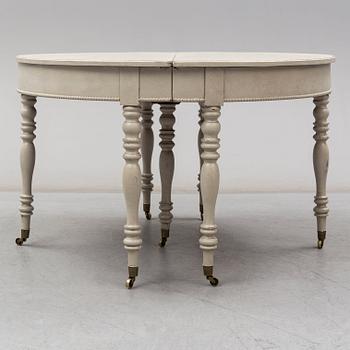 A mid 19th century painted dining table.