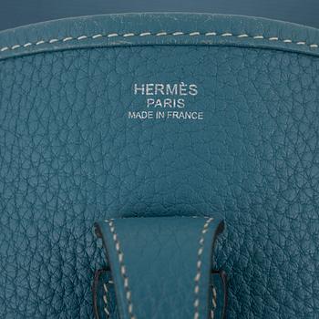 Hermès, A blue Taurillon Clemence leather Evelyn bag, 2008.