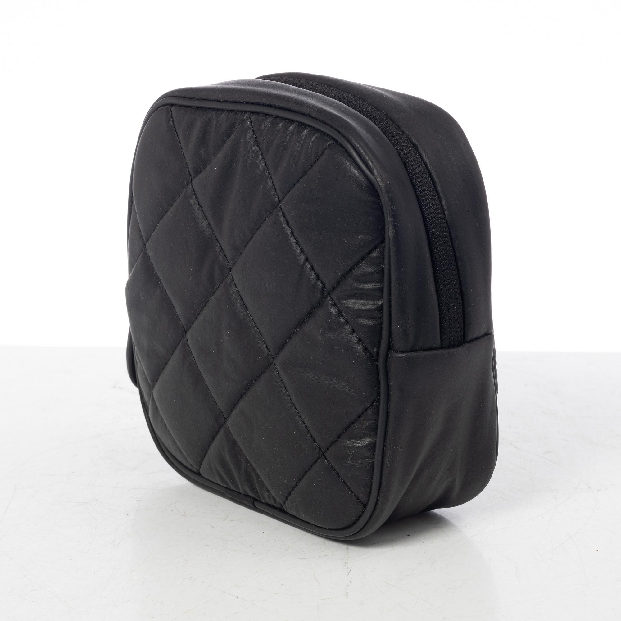 Chanel, tennis racket and 4 balls with case.