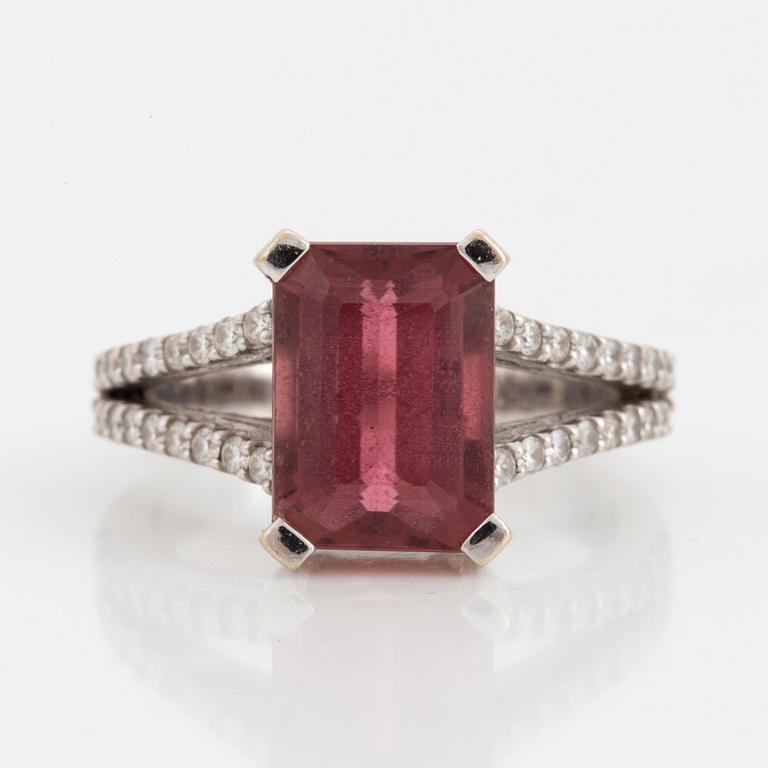 An emerald-cut pink tourmaline and diamond ring.