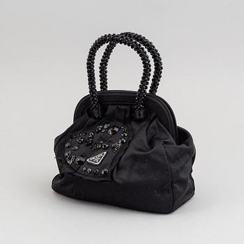 Prada, an evening bag.