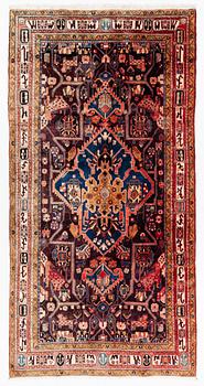 An oriental rug, c. 300 x 155 cm.