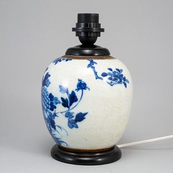 A blue and white jar made in to a lamp, China, early 20th Century.