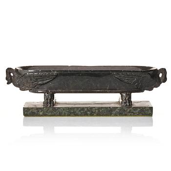 176. A stone sarcophagus shaped bowl late 19th century.