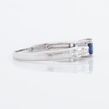 A sapphire and baguette cut diamond ring.