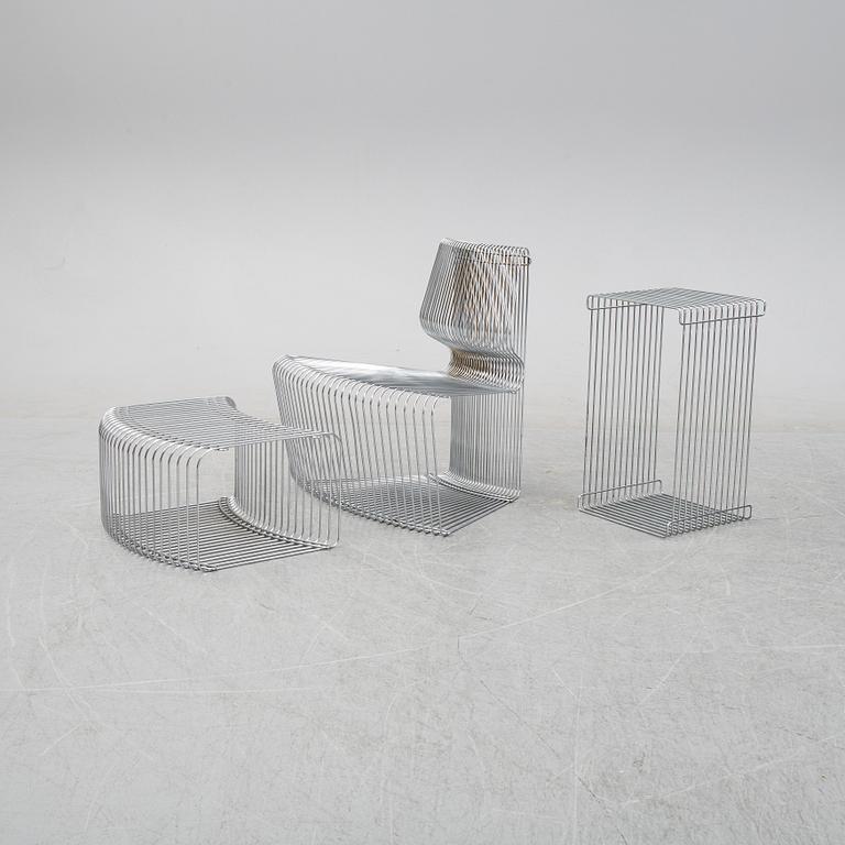 A 'Pantanova convex' chair with foot stool and a 'Wire Extendted' shelf, Verner Panton, Montana, Denmark.