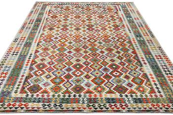 A Kilim carpet, c. 490 x 310 cm.