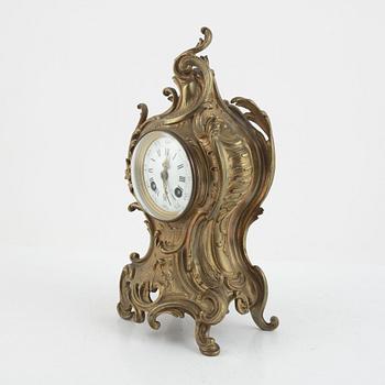 A Rococo style mantle clock, circa 1900.