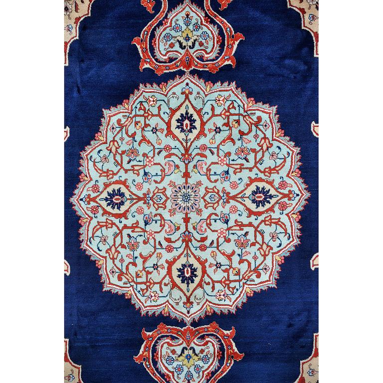A carpet, Tabriz signed Nematzadeh, ca 291 x 176 cm.