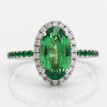 A 14K white gold ring, with tsavorite garnets and diamonds.