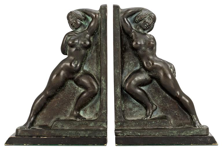 A pair of Axel Gute bronze book stands, 1919.