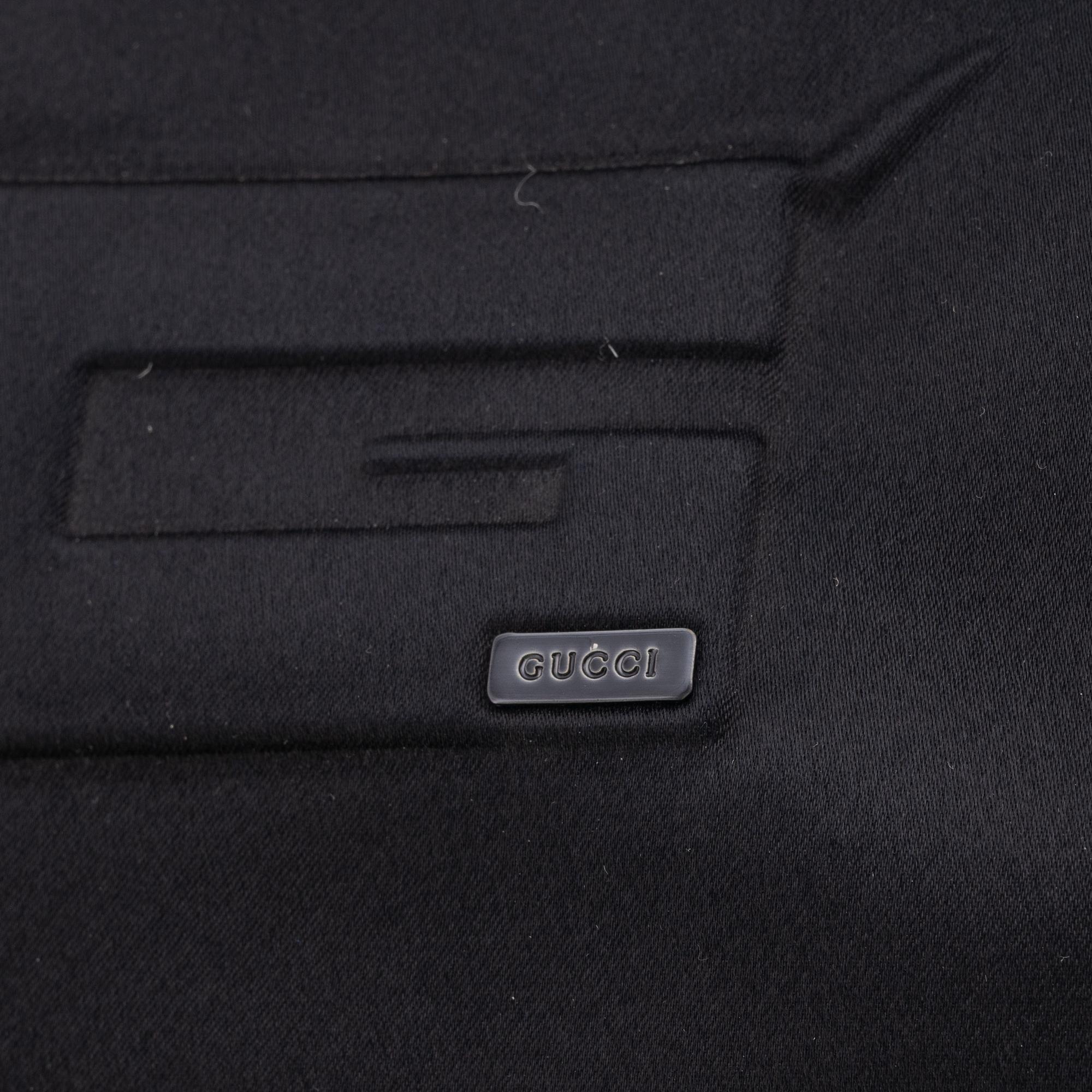 Gucci, a black satin handbag.