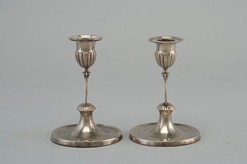 A PAIR OF CANDLE STICKS, silver. Gustaf Holmberg (1826-67) Turku. Led filled. Height 11 cm.