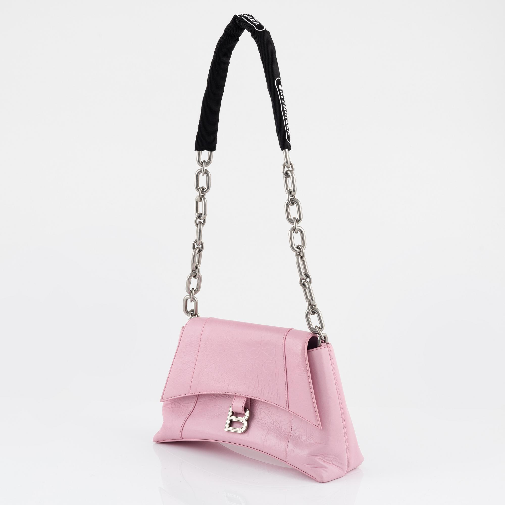 Balenciaga, a pink leather 'Downtown' bag.