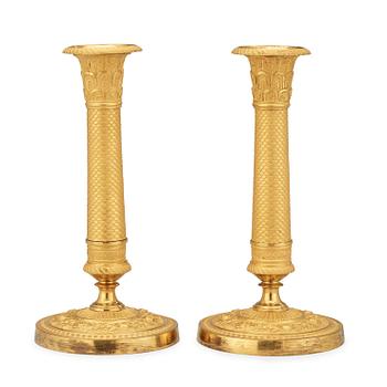 1624. A pair of Empire candlesticks.