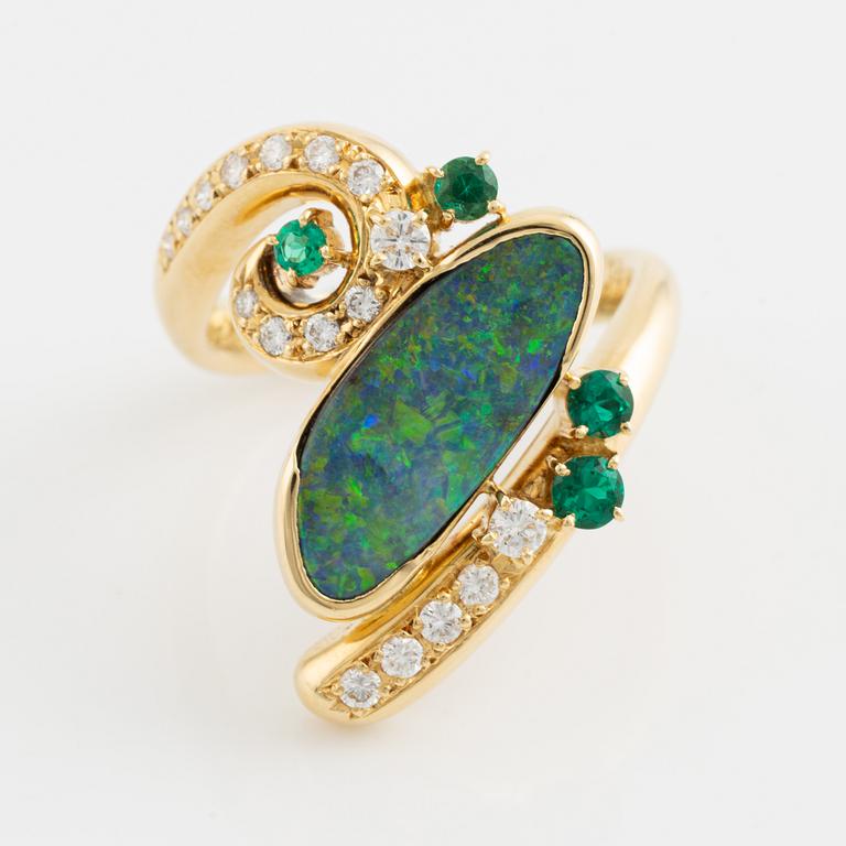 Opal, emerald and brilliant cut diamond ring.