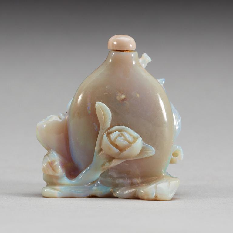 A carved snuff bottle, presumably opal.