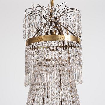 An Empire nine-light gilt-brass and cut-glass, Stockholm, early 19th century.