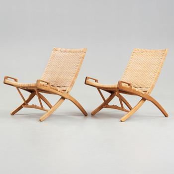 Hans J. Wegner, A pair of Hans J Wegner model 512 oak 'Folding Chairs' executed by Johannes Hansen, Denmark 1950's.