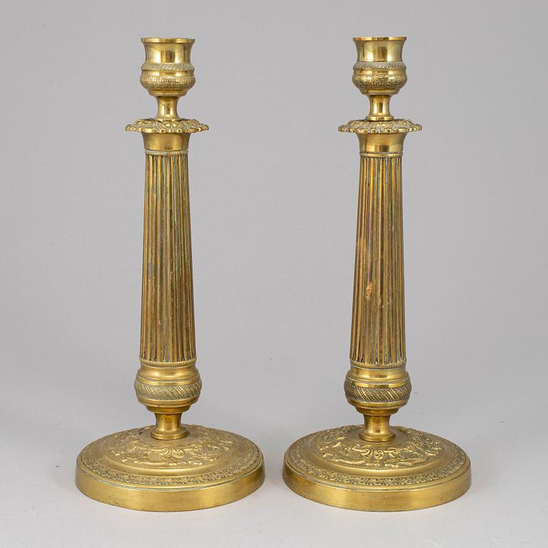 A pair of empire bronze candlesticks, first half of the 19th century.