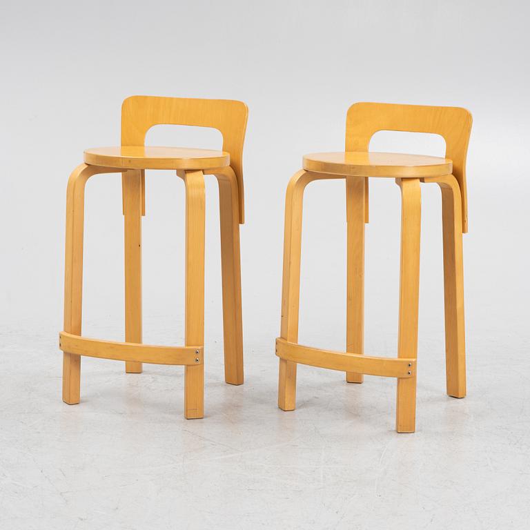 Alvar Aalto, two model 'K65' bar stools, Artek, Finland.