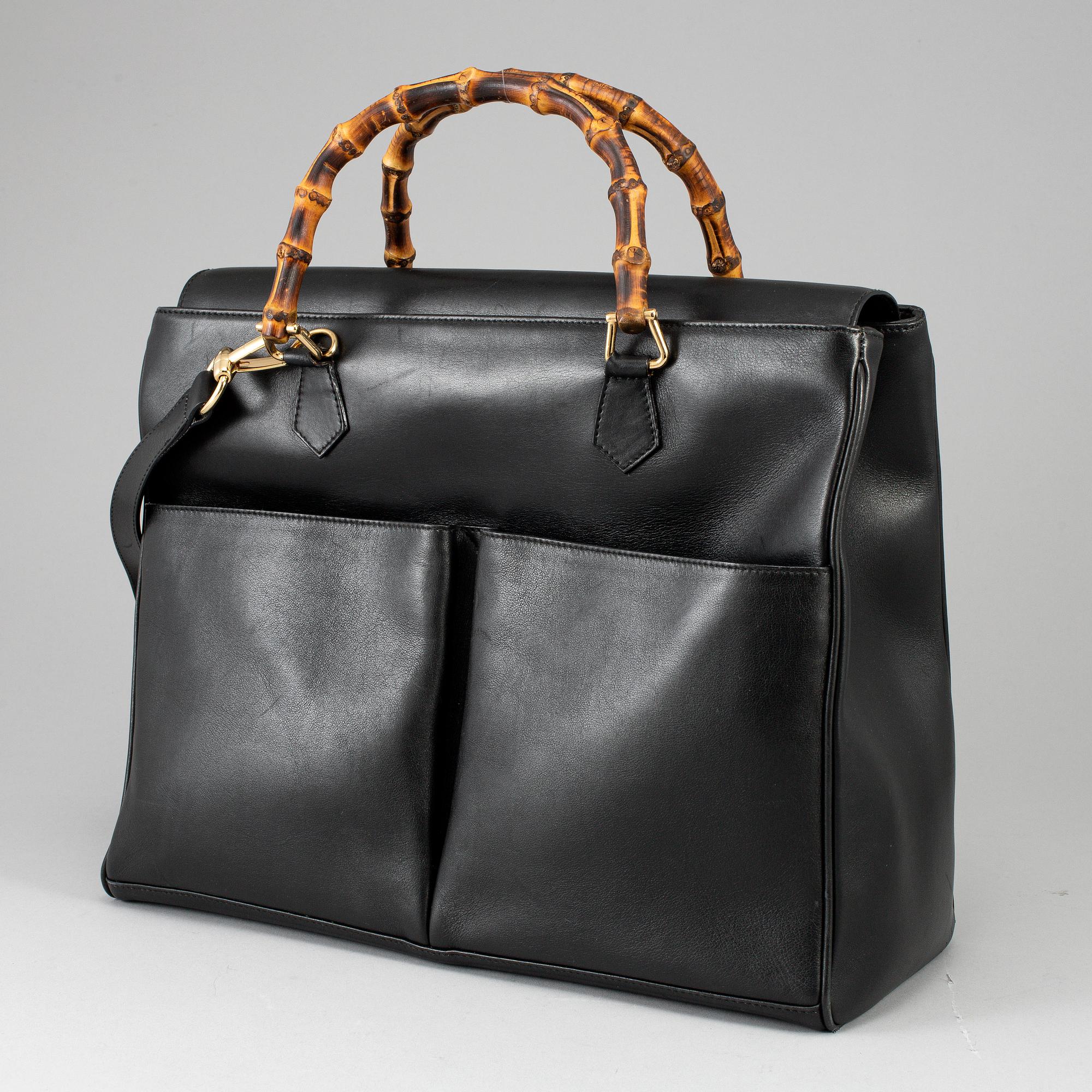 GUCCI, a leather bag/briefcase.
