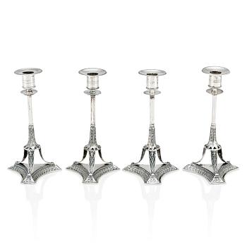 264. A set of four Swedish early 19th Century silver candlesticks, mark of Adolf Zethelius, Stockholm 1814 and 1818.