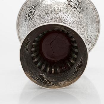 A Tibetan butter lamp, silver, early 19th century.