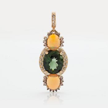 907. A PENDANT set with a green tourmaline and opals.