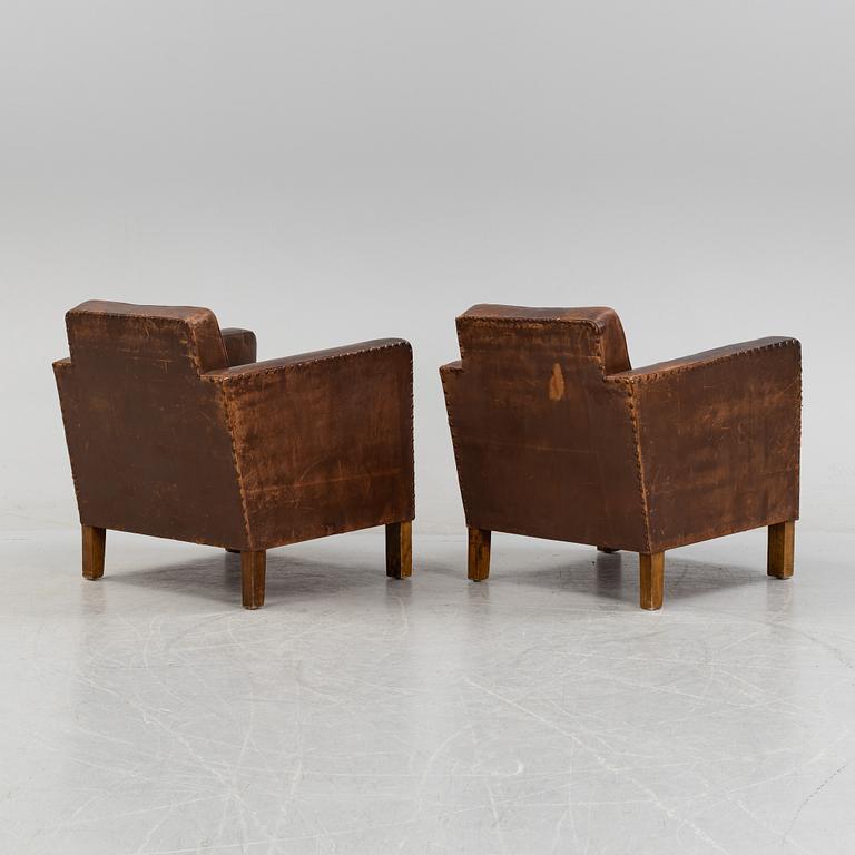 Björn Trädgård, attributed to, a pair of leather lounge chairs from Firma Svenskt Tenn, mid 20th Century.